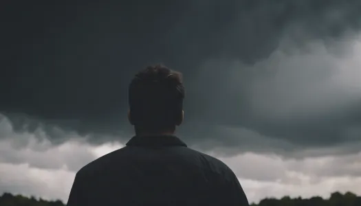 A person looking stressed with a dark cloud overhead